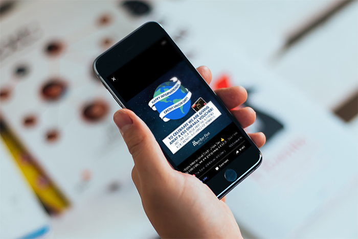 Person holding smartphone, displaying a digital marketing agency ad in Dublin for web design and development services.