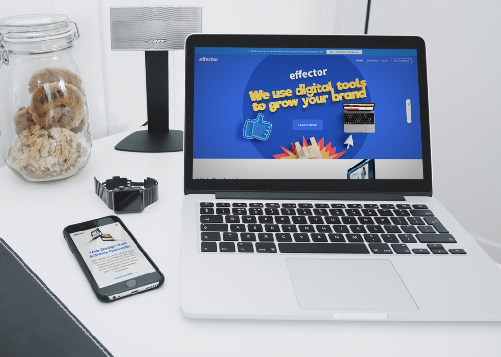 Laptop and phone display digital marketing agency services in Dublin office setting.