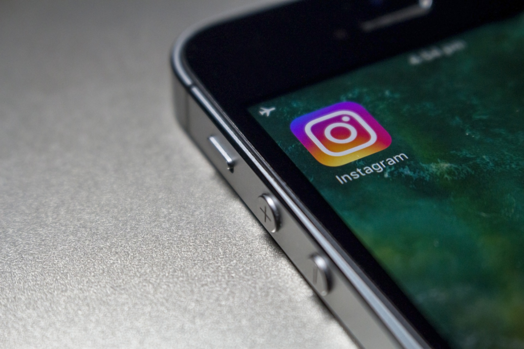 Close-up of smartphone screen displaying Instagram app icon, Dublin digital marketing agency services.