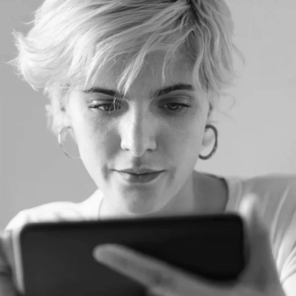 ```markdown
Person engaging with digital content on a tablet, representing a digital agency based in Dublin.
```
